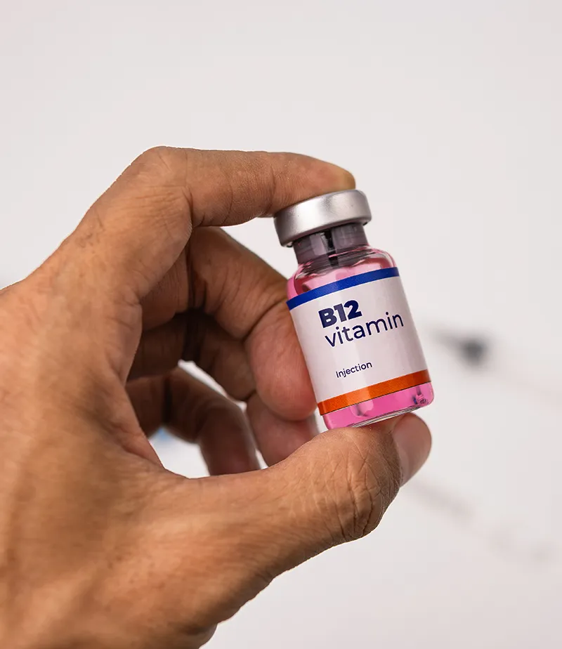 doctor holds a bottle b12 vitamin injection doctor holds a bottle b12 vitamin injection