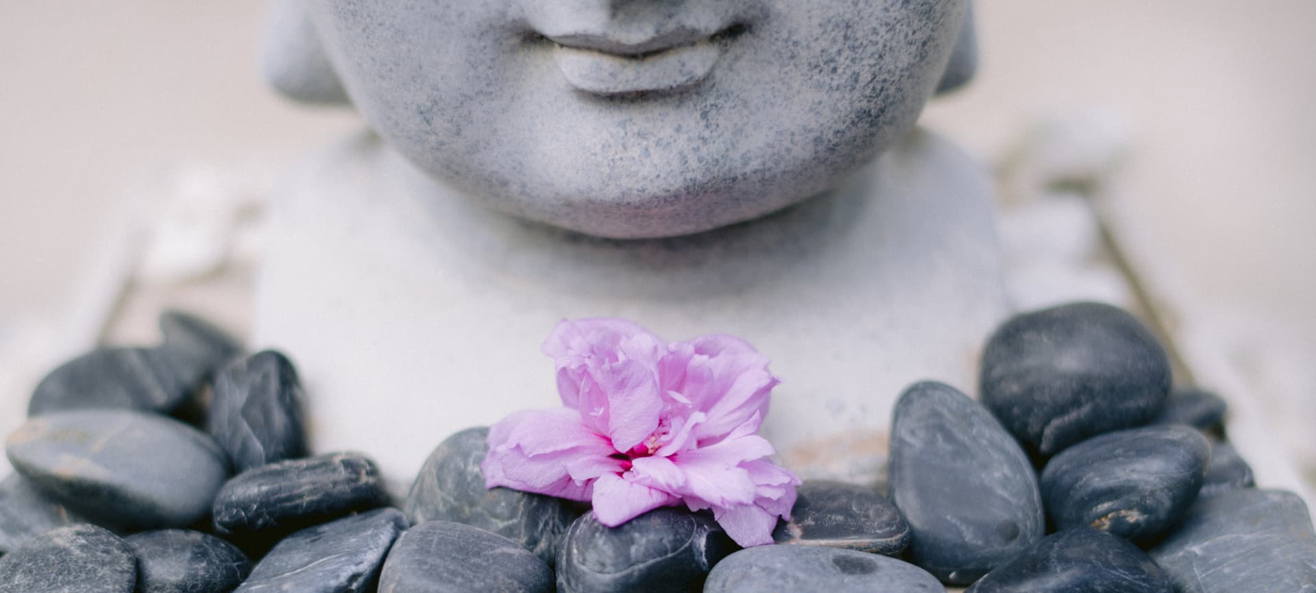 Serene spa environment with massage table and soft lighting flowers in a stone