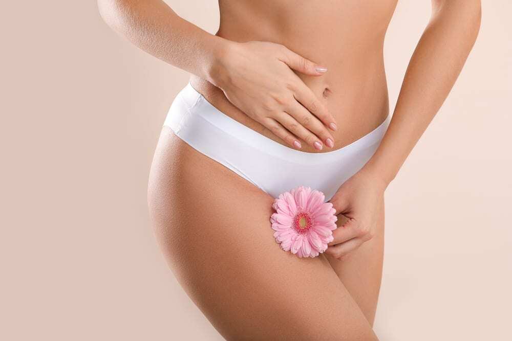 Woman enjoying a relaxing facial massage at a spa Spa intimacy wellness setup with flowers