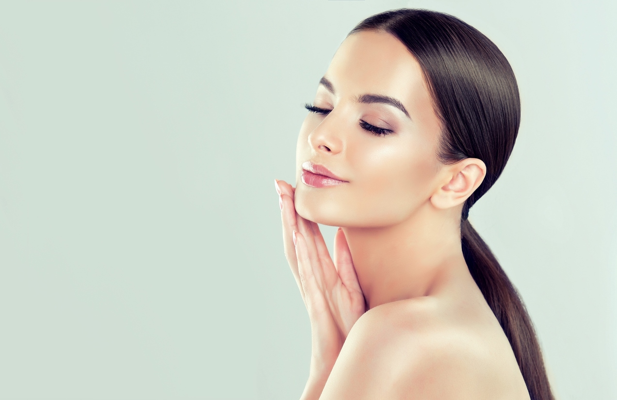 Woman receiving Botox cosmetic treatment at spa person undergoing facial rejuvination
