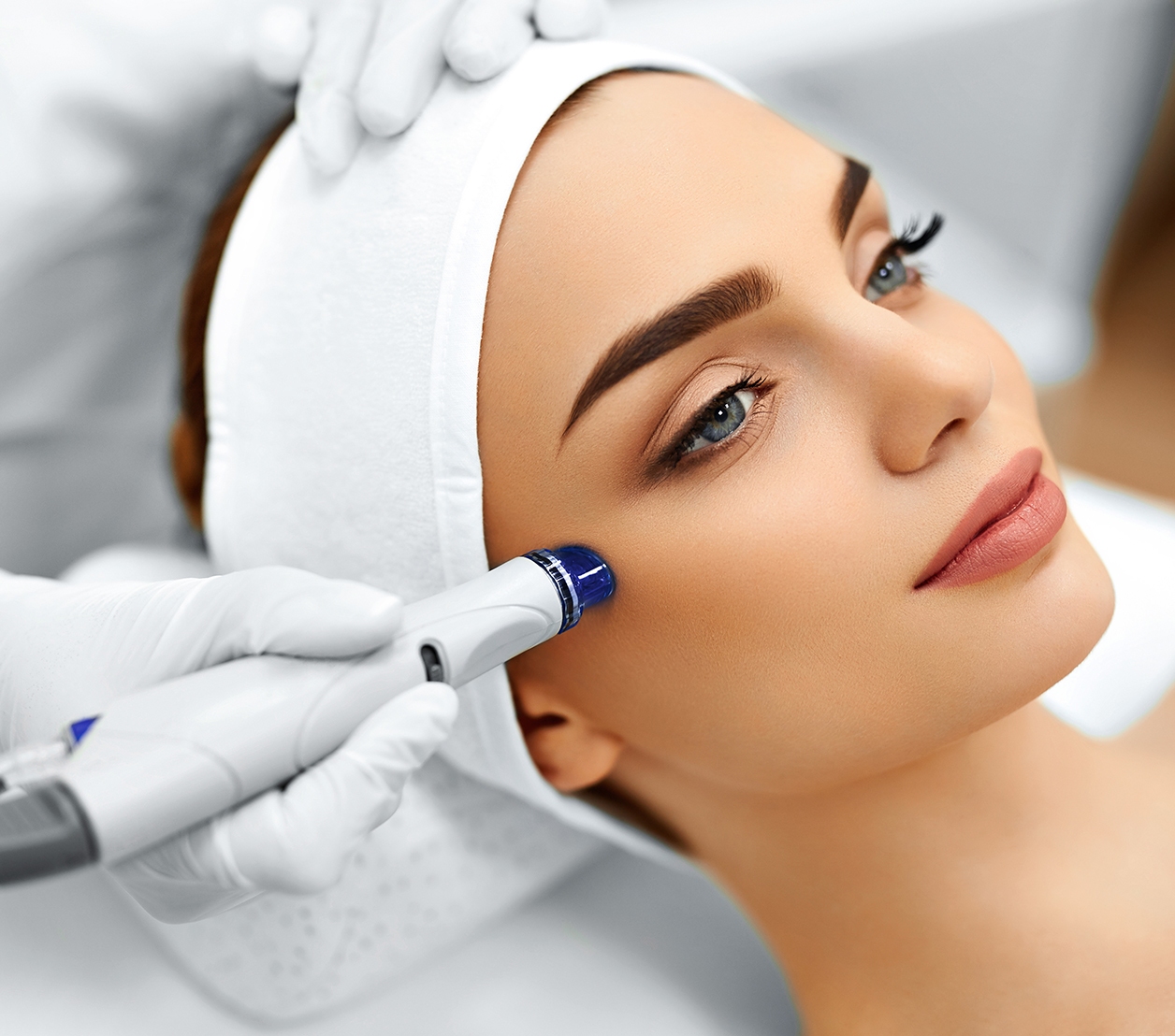 Close-up Of Woman Getting Facial
