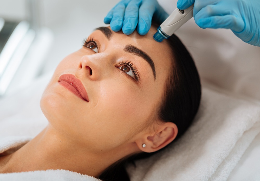 beautiful woman during hydrafacial procedure beautiful woman during hydrafacial procedure