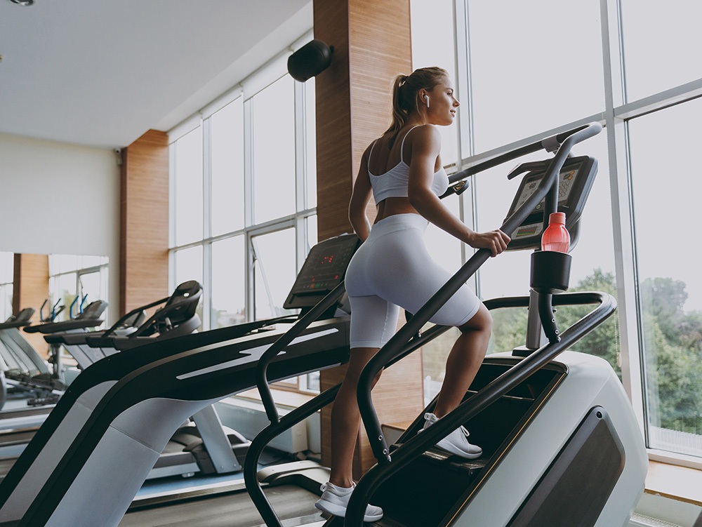sportswoman woman in white sportswear earphones sportswoman woman in white sportswear earphones